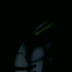 Animated sequence showing a stylized character with glowing green eyes and white body parts against dark background, transitioning between different eye states.