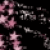 Pixelated pink and gray floral shapes float against a black background with no visible text or distinct figures.