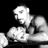 Static grayscale buddy icon showing a pixelated figure with raised arm and open mouth against black background, rendered in low-resolution dithering style.