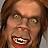 Close-up of a pixelated face with reddish-brown hair, golden eyes, and an open mouth showing teeth; the expression appears aggressive.