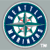 Circular icon with dark blue background, teal border, and white accents; four quadrants divided by a cross shape containing small red details.