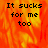 A pixelated image with orange and red flame-like background displaying black text "It sucks for me too" in three lines, partially overlaid by a gray rectangle on the right side.