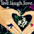 A pixelated image shows a heart-shaped object with green and white patterns, held by hands against a light background with scattered colored dots.