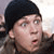 Two men in a pixelated animated contact sheet with one wearing a black beanie and the other a white cap, both with surprised expressions.