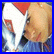 Static pixelated image of a person's face with red hair and blue clothing against a solid blue border, rendered in low-resolution style typical of early internet icons.
