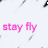 Static image with pink text on a white background featuring scattered black speckles.