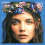 A pixelated image of a person with long dark hair wearing a floral crown, shown in three cropped views against blue and gray backgrounds.