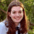 A pixelated image of a person with long brown hair wearing a white shirt and dark tie, positioned next to green text reading 'Original Icons .com' on a solid background.