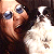 Pixelated close-up of a person with light skin and dark hair, wearing blue-tinted glasses, mouth open in an expressive gesture against a bright background.