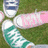 A static image with four text sections and a small grassy background photo showing shoes.