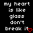 Black background with white pixelated text reading 'my heart is like glass don't break it' and a red pixelated heart symbol at the bottom right.
