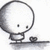 A round-headed character with small eyes stands on a flat surface holding a heart-shaped object, shown in three