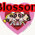 Pixelated heart-shaped icon with a character inside, overlaid text in red, cyan, and green.