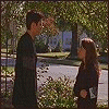 Six- shows outdoor scene with two people interacting, text overlays, and a kiss. A man in dark clothing stands near trees while a woman faces him; later they embrace