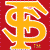 A pixelated yellow stylized letter S with red interior details on a solid red background, featuring a small brown and yellow emblem at the bottom right.