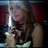 A pixelated image shows a person holding a sword-like object with a bright light source, against a dark background with red and blue tones.