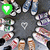 pixelated icons featuring heart symbols in green and purple, with diamond shapes and other patterns on a dark background
