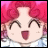 Pixelated anime-style character with pink curly hair, closed eyes, and open mouth on left; black background with white text on right.