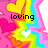Pixelated rainbow starburst with pink hearts and white heart center, displaying text fragments 'loving', 'is for', 'lovers' across four quadrants.