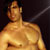 Static 50x50 pixel buddy icon showing a shirtless male figure with golden-brown skin tones against dark background, rendered in low-resolution pixel art style with visible dithering and blocky edges.