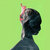 Pixelated profile of a person with dark hair against a light green background, wearing a dark top.