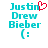 Pixelated text 'Justin Drew Bieber' in cyan with a red heart symbol replacing the 'i' in 'Justin' and a cyan smiley face below.