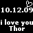 Black background with white pixelated text and symbols: '10.12.09' repeated, two instances of 'i love you', and 'Thor' below each phrase, plus a heart cursor above the date.