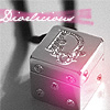 A pink and silver jewelry box with a heart-shaped clasp and gem details, positioned on a light surface with a blurred background.