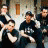 Animated contact sheet showing two frames of a pixelated group photo with green text logo on the right side.
