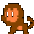 Pixelated brown monkey with orange face and chest, standing against gray background.