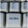 A close-up of a keyboard key labeled 'Oh Shit' with 'THE PANIC BUTTON' text above it, showing partial surrounding keys.