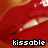 A 3x3 contact sheet of a single animated icon showing red lips with white teeth and the word 'kissable' in pixelated text across nine frames, each frame displaying slight variations in lip position and mouth opening.