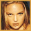 Pixelated image of a person with light brown hair and fair skin, wearing a dark brown corset-style top with black buttons.