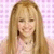 A person with long blonde hair and bangs wears a light pink top against a checkered background, smiling in multiple views.