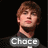 Pixelated image of a person with light brown hair and fair skin, wearing dark clothing against black background.