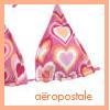 A static icon featuring two overlapping triangular shapes with heart motifs in pink, orange, and white tones, set against a white background with a peach border.
