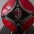 Red and black diamond-shaped icon with silver accents, featuring a central circular emblem containing 'AC' text and a cross symbol.
