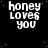 Black background with scattered yellow dots and white text reading 'honey loves you' in three lines, arranged in a