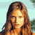 Pixelated static image of a person with long brown hair against a light blue background, rendered in low-resolution 256x256 pixels.