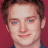 Pixelated portrait of a person with brown hair against red background, adjacent to green text reading 'OriginalIcons.com' in bright green pixel font.
