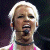A pixelated contact sheet showing two frames of an animated icon featuring a person with blonde hair and pink clothing on the left, next to green text reading "Original Icons .com" on a dark background.