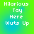 Green and blue gradient background with white pixelated text reading "Hilarious Toy Here Wuts Up" in two identical vertical arrangements.