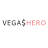 Pixelated text reads VEGAS$HERO with gray letters on the left and pink letters on the right against a white background.