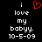 A pixelated image with white text on black background reading "i love my babyy. 10-5-09" and a red heart symbol above the word "love", displayed in two side-by-side identical