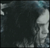 A grayscale animated sequence shows a person with long dark curly hair turning their head from left to right