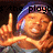 A person wearing a blue beanie and gray shirt makes a gesture with one hand raised and the other hand near their face, with text above their head.