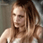 Static 48x48 pixel icon of a person with long brown hair wearing a white top, displayed against a gray background.