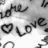 Black-and-white image with repeated 'love' text and heart symbols, featuring a shoe in the lower portion.