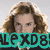 Pixelated image of a person with curly brown hair and a light background, overlaid with teal and green text elements.