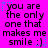 A static image with a bright pink background displays repeated text in black pixelated font, surrounded by small blue and purple star-like shapes.